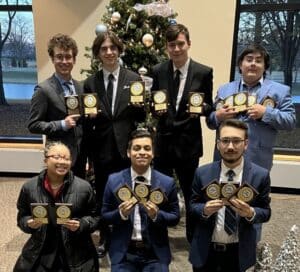 Members of the award-winning Moraine Valley Community College Speech and Debate Team from their most recent first place win include (back row left to right) Gabe Dunkle