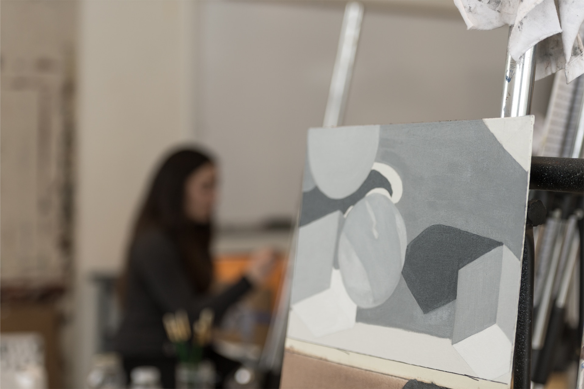 canvas on an easel with geometric shapes