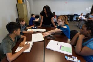 A teacher and students work together at the Valley Learning Center.