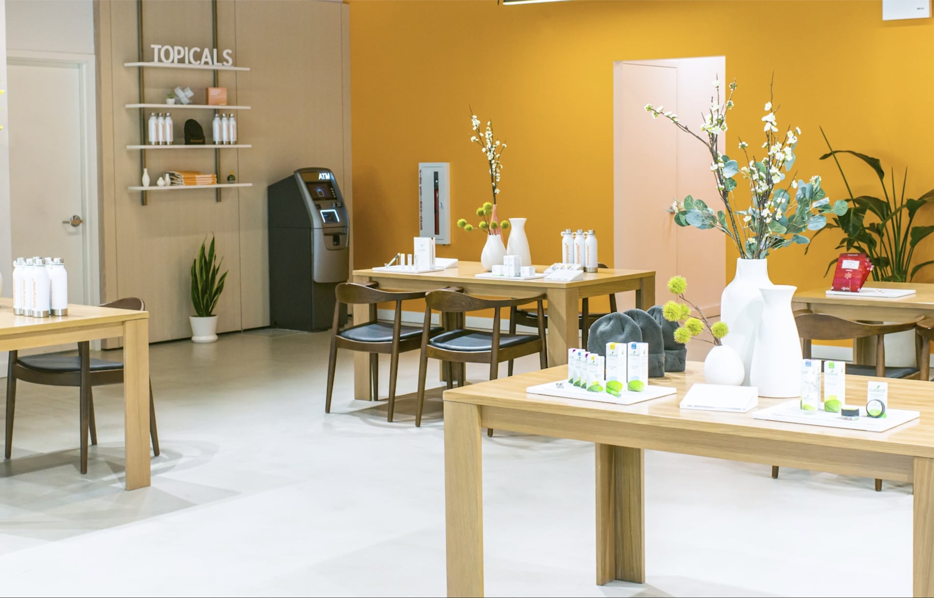 cannabis retail store with tables and product.