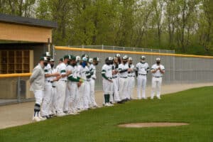 The Moraine Valley baseball team stands in a line on the field