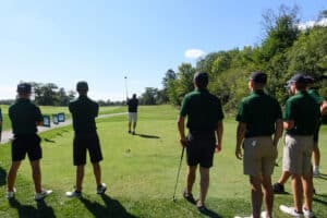 People standing on the golf course