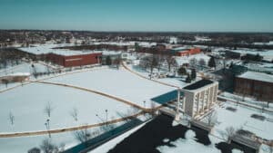 |Aerial view of the gateway and exterior of campus during fall
