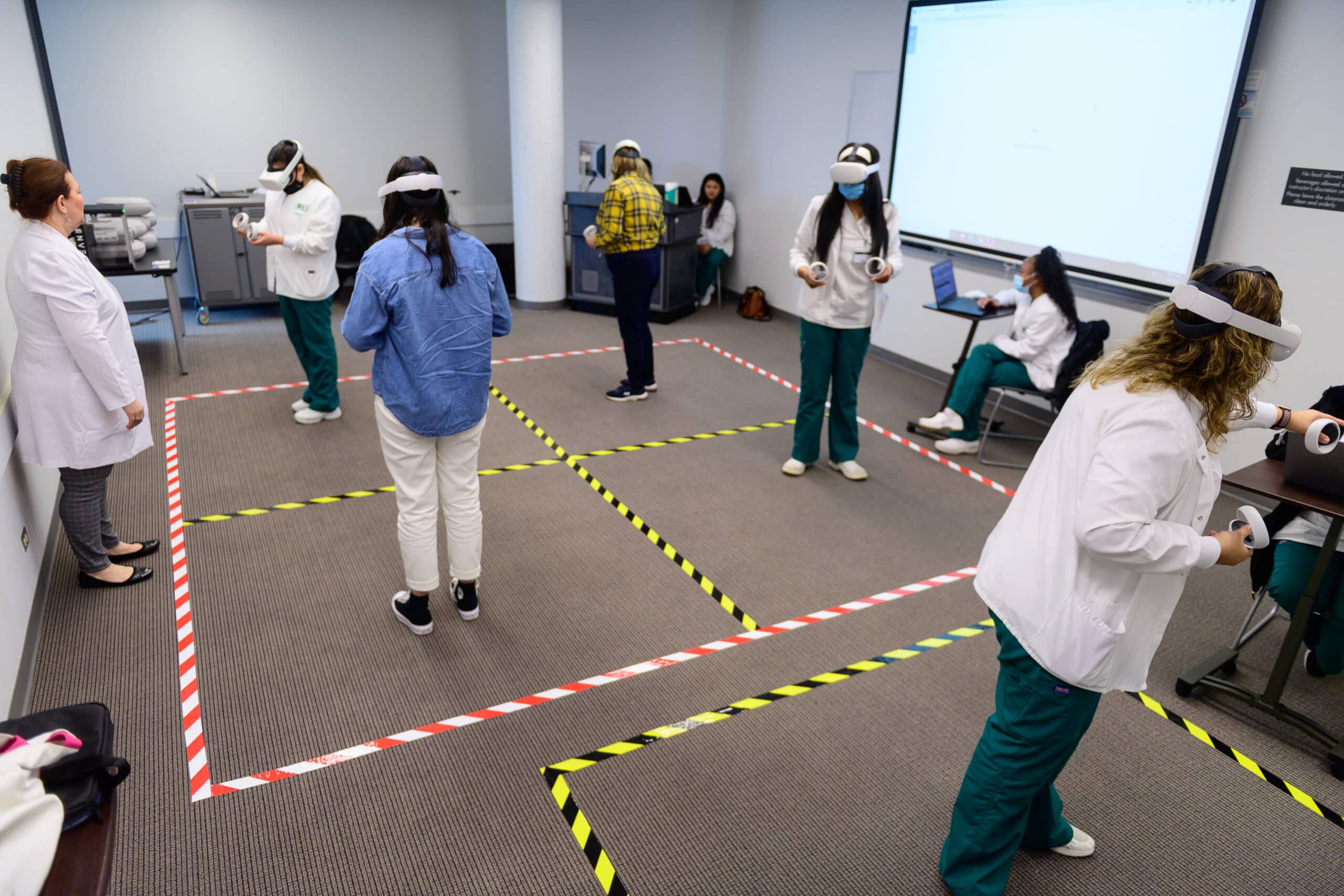 Students use virtual reality equipment to simulate treating patients in a Moraine Valley Community College nursing class.
