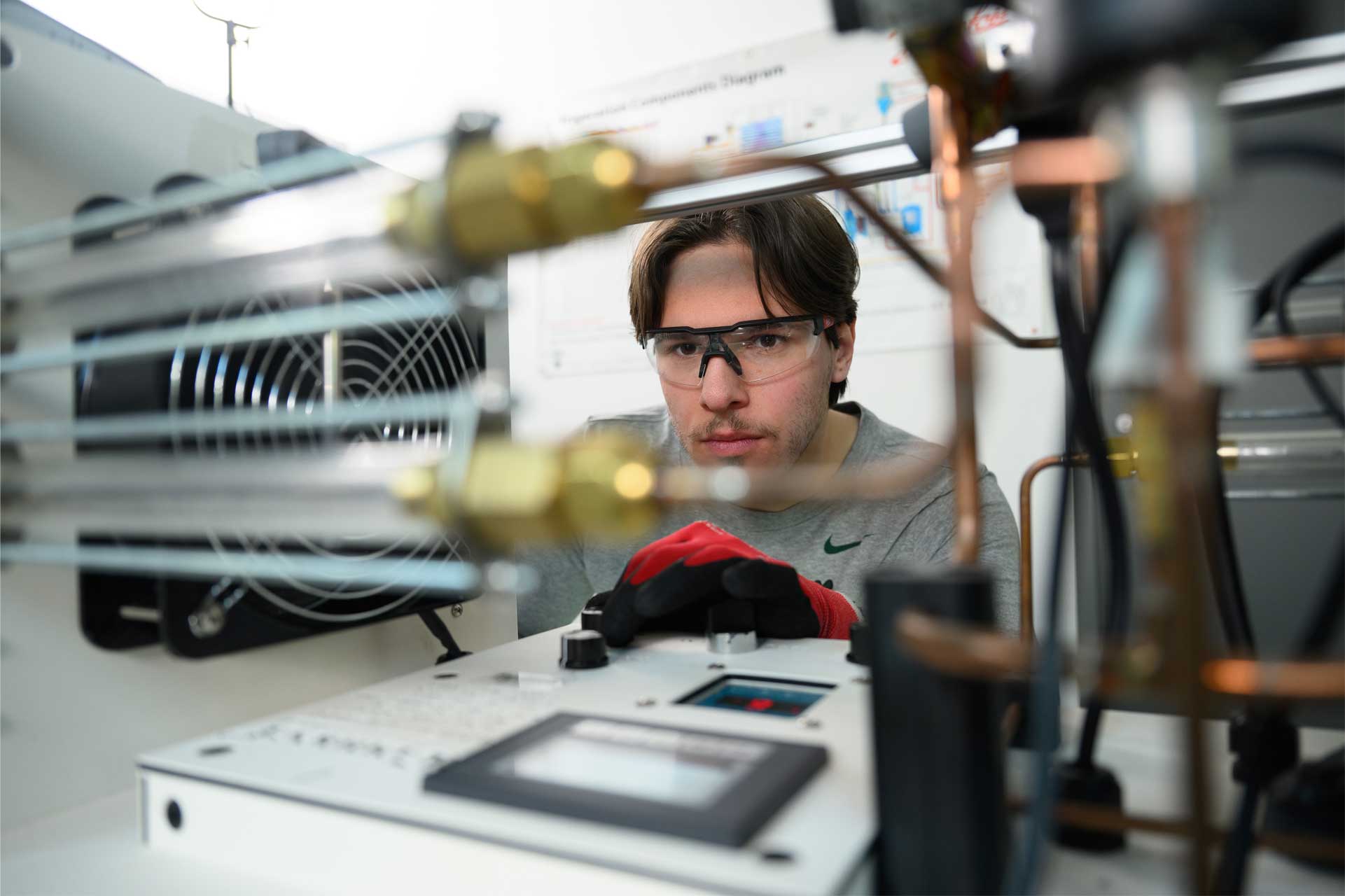 man looking at air conditioning unit