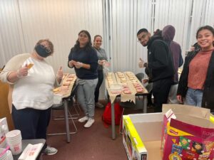 Students from Moraine Valley’s Honors Introduction to Psychology class pack lunches to be distributed to homeless individuals as part of a service-learning project.