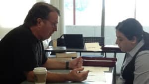 Jeff Williams (left) tutors a student.