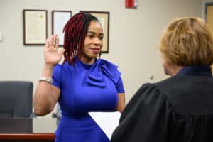 Tiffany Robinson being sworn in as a member of the Board of Trustees